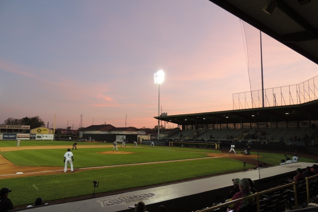 Purple and pink hues filled the sky at sunset during Thursday's game at Ashford University Field in Clinton, Iowa.