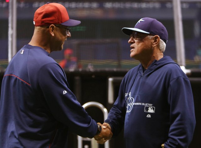 Terry Francona (left) and Joe Maddon shake hands during batting practice before an Indians-Rays game in 2013. (Photo by Chris Zuppa/Tampa Bay Times)